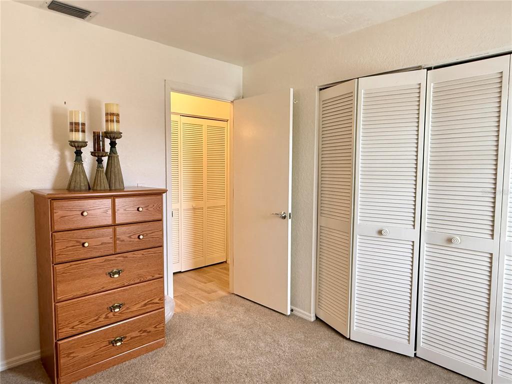 26267 Northern Cross Road, Unit 1A Punta Gorda, FL 33983 - Photo 22 of 34 a view of a dresser with storage