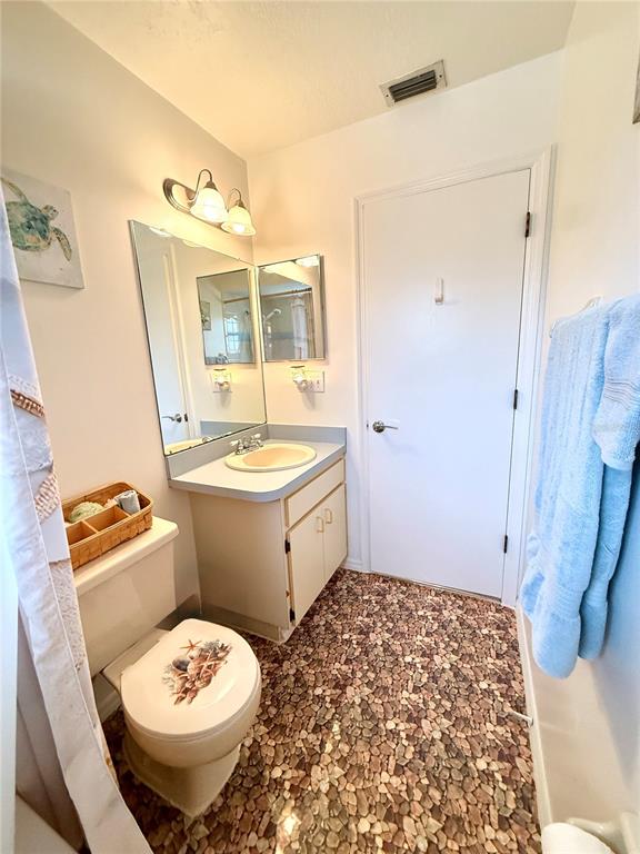 26267 Northern Cross Road, Unit 1A Punta Gorda, FL 33983 - Photo 24 of 34 a bathroom with a sink toilet and shower