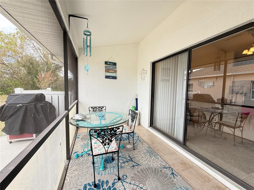 26267 Northern Cross Road, Unit 1A Punta Gorda, FL 33983 - Photo 28 of 34 a view of a dining room with furniture window and outside view