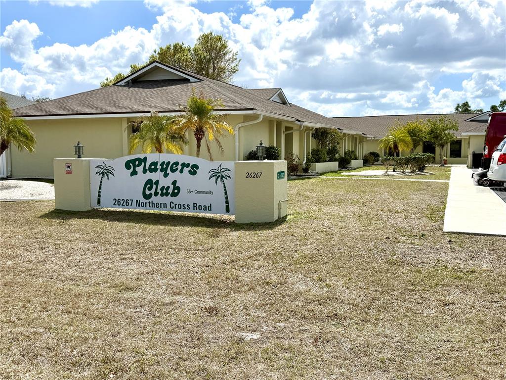 26267 Northern Cross Road, Unit 1A Punta Gorda, FL 33983 - Photo 30 of 34 a front view of a house with garden