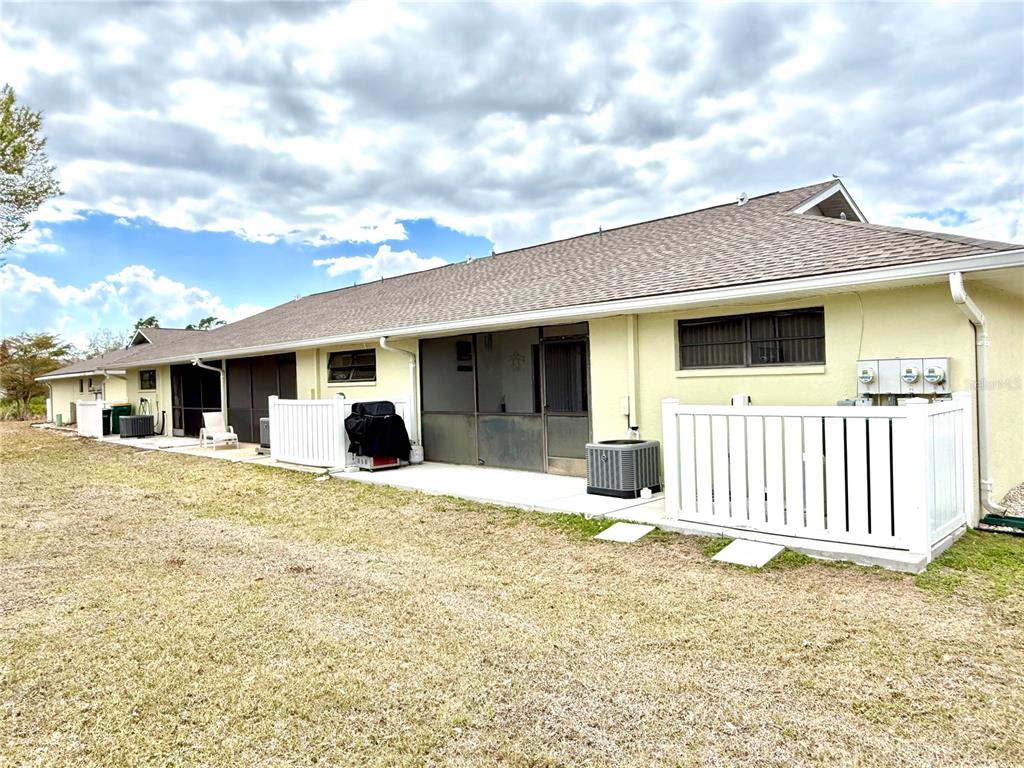 26267 Northern Cross Road, Unit 1A Punta Gorda, FL 33983 - Photo 33 of 34 a front view of a house with a yard