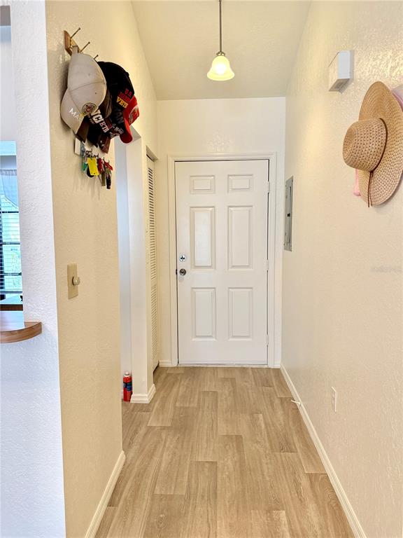 26267 Northern Cross Road, Unit 1A Punta Gorda, FL 33983 - Photo 5 of 34 a view of a room with wooden floor and bathroom