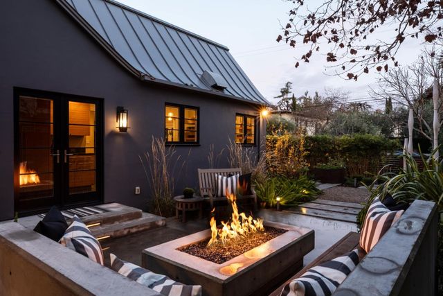 a backyard of a house with seating space