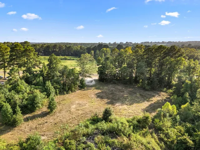 a view of a field with an outdoor space