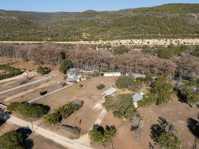 an aerial view of house with yard