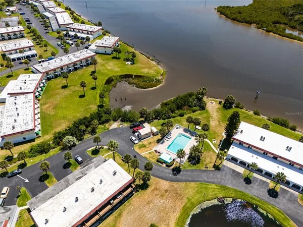 an aerial view of a house a yard and outdoor seating