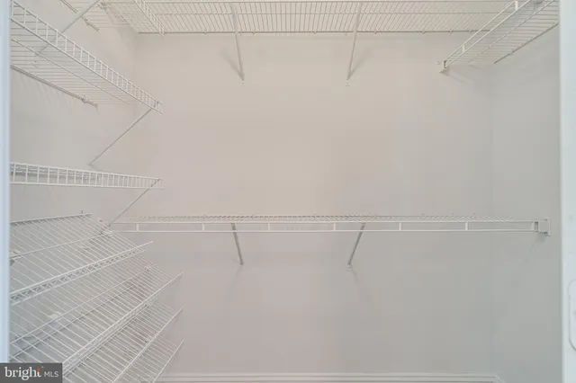 a view of a hallway with staircase