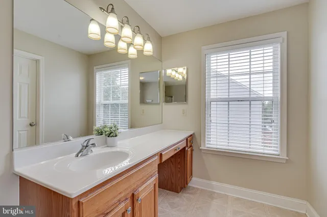 a view of an empty room with a ceiling fan
