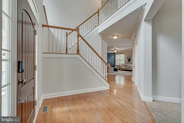 a living room with furniture a fireplace and a large window