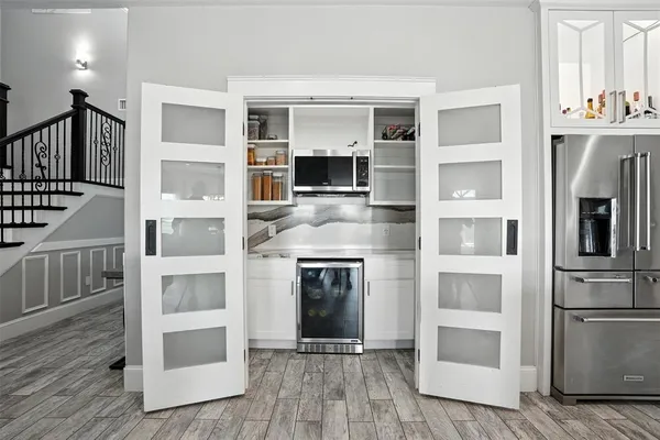 a kitchen with granite countertop a stove and a refrigerator