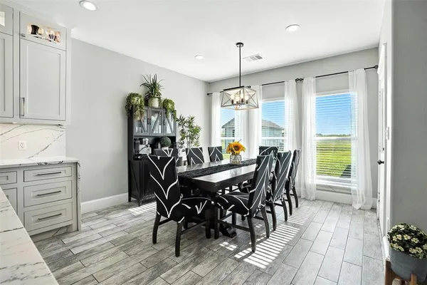 a view of a dining room with furniture window and outside view