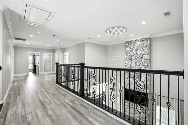 a view of gallery with wooden floor