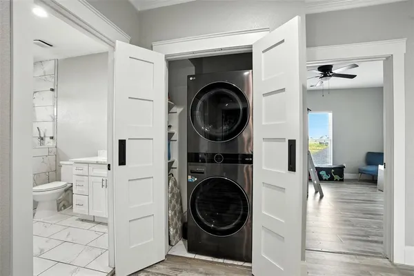 a view of a hallway with washer and dryer