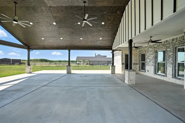 a view of an empty room with a floor to ceiling window and a floor to ceiling window