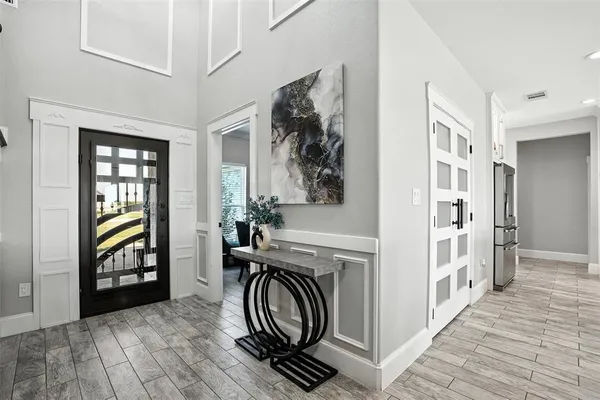 a view of an entryway with wooden floor