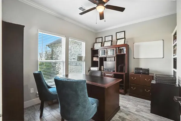 a dining room with furniture and window