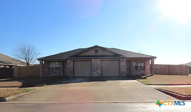 a front view of a house with a garage