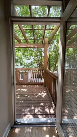 a view of gallery with wooden floor