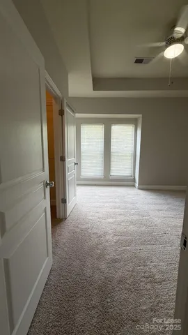 a spacious bathroom with double sink and a mirror