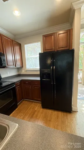 a view of a closet with wooden floor