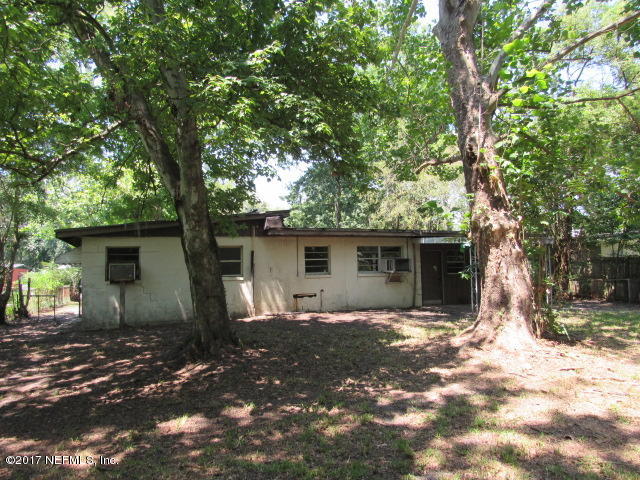 7008 Rollo Road Jacksonville, FL 32205 - Photo 4 of 14 a house with trees in the background
