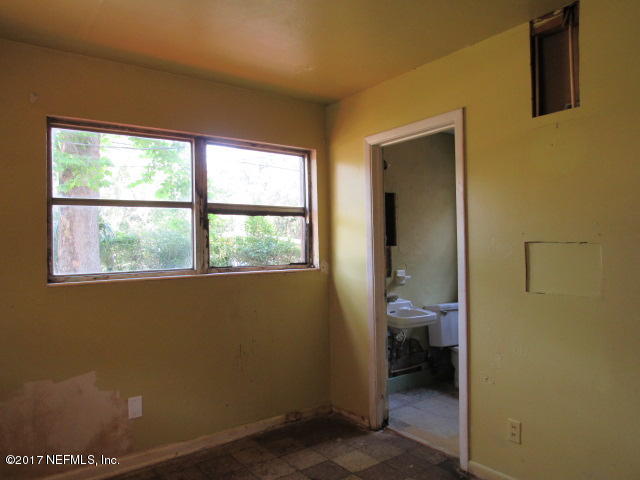 7008 Rollo Road Jacksonville, FL 32205 - Photo 10 of 14 a view of a bathroom from a bathroom