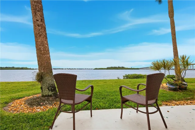 a view of a house with backyard porch and sitting area