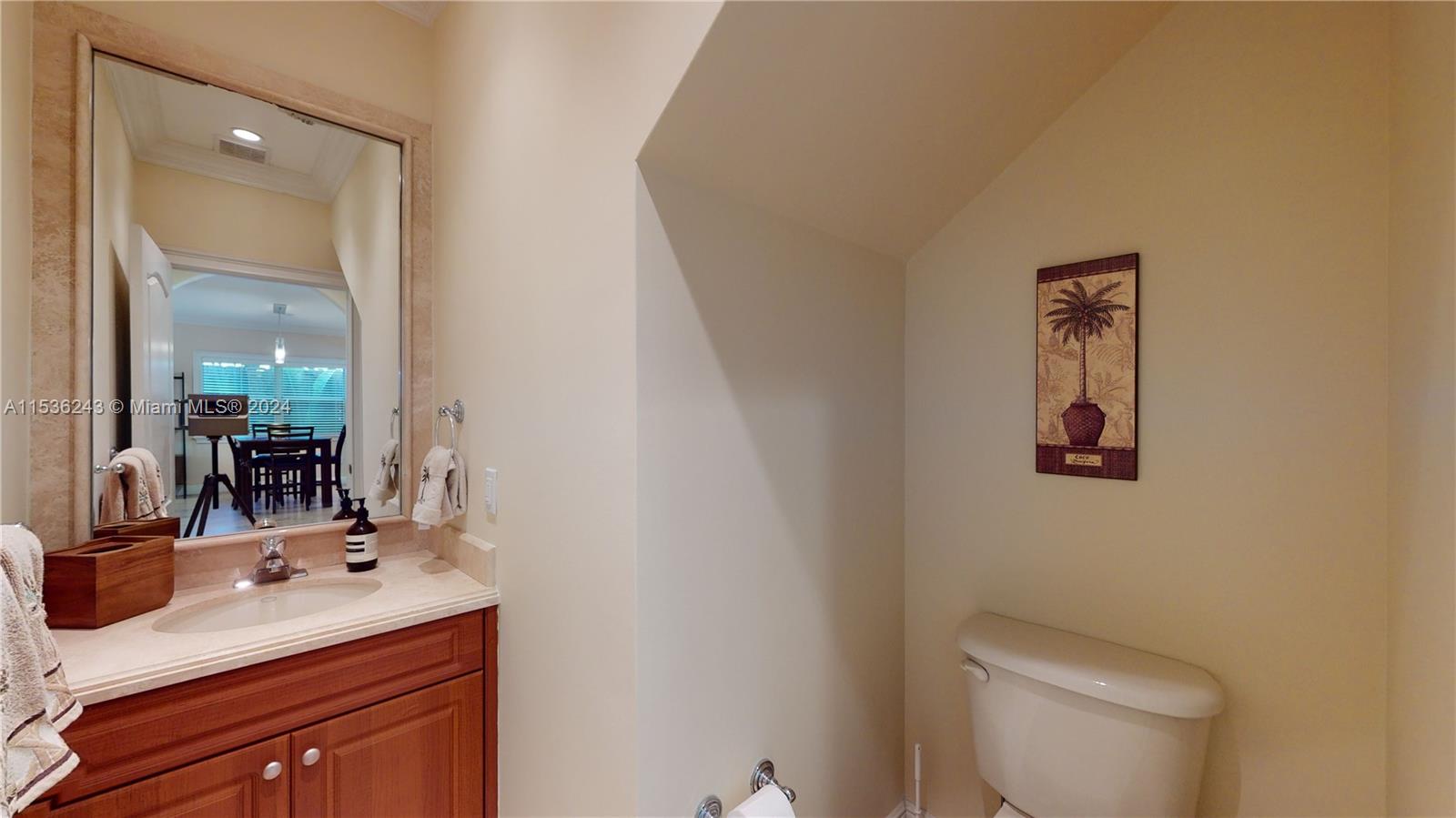 3060 Indiana Street, Unit 3060 Coconut Grove, FL 33133 - Photo 11 of 52 a bathroom with a sink vanity mirror and toilet