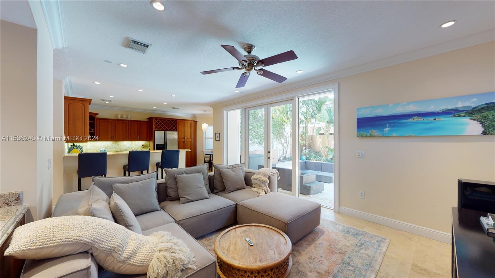 3060 Indiana Street, Unit 3060 Coconut Grove, FL 33133 - Photo 17 of 52 a living room with furniture a ceiling fan and a window