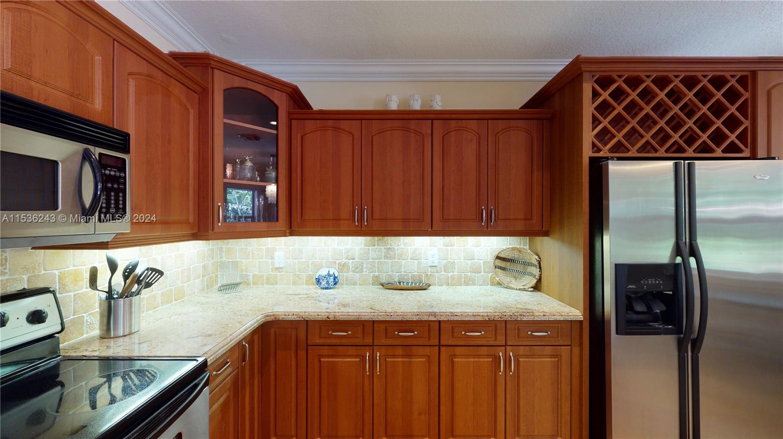 3060 Indiana Street, Unit 3060 Coconut Grove, FL 33133 - Photo 20 of 52 a kitchen with a sink and cabinets