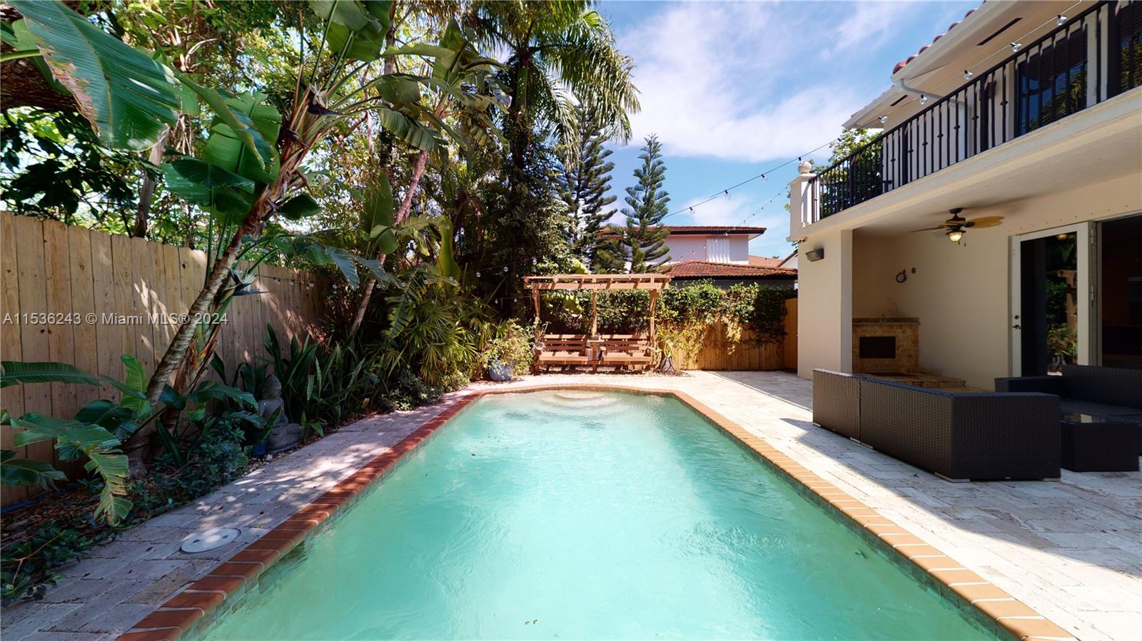 3060 Indiana Street, Unit 3060 Coconut Grove, FL 33133 - Photo 27 of 52 a view of a swimming pool with a patio