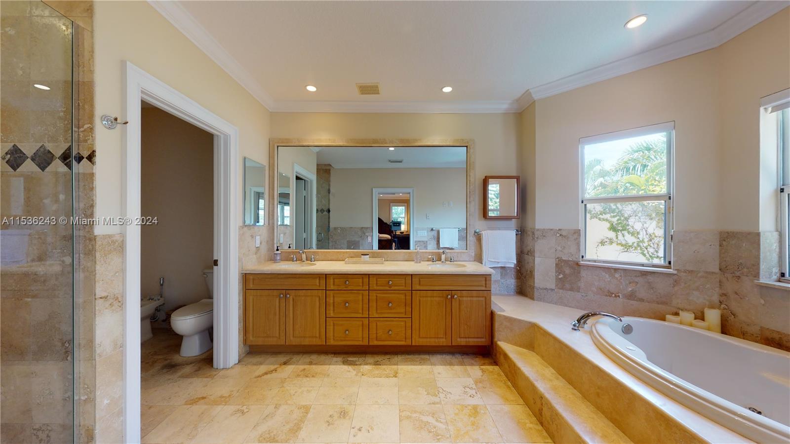 3060 Indiana Street, Unit 3060 Coconut Grove, FL 33133 - Photo 36 of 52 a large bathroom with a large tub and shower