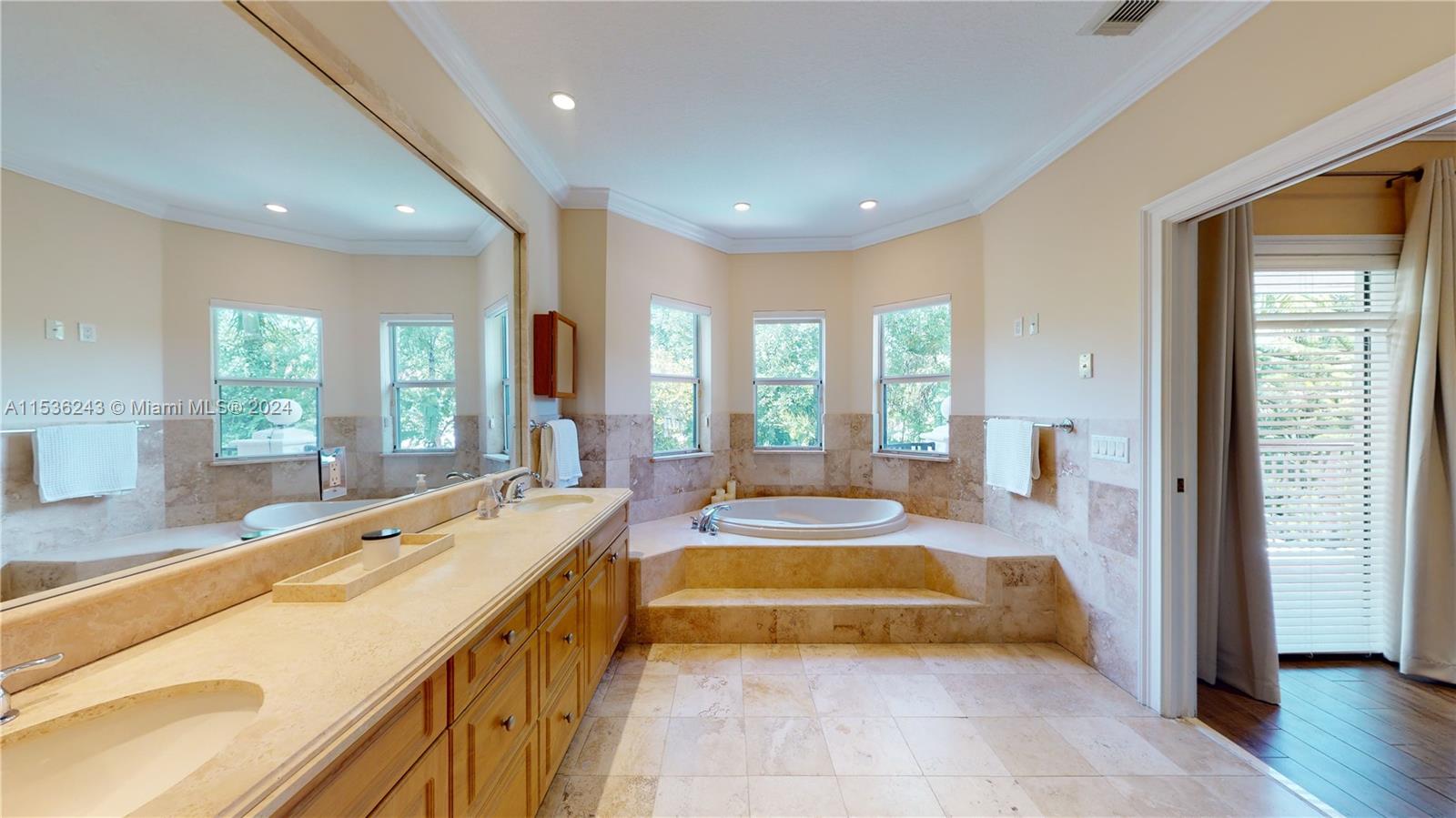 3060 Indiana Street, Unit 3060 Coconut Grove, FL 33133 - Photo 39 of 52 a spacious bathroom with a tub and sink