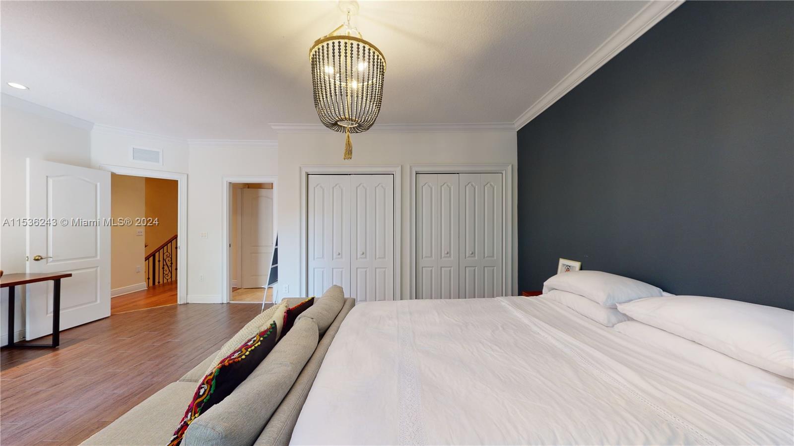 3060 Indiana Street, Unit 3060 Coconut Grove, FL 33133 - Photo 44 of 52 a bedroom with a bed and wooden floor