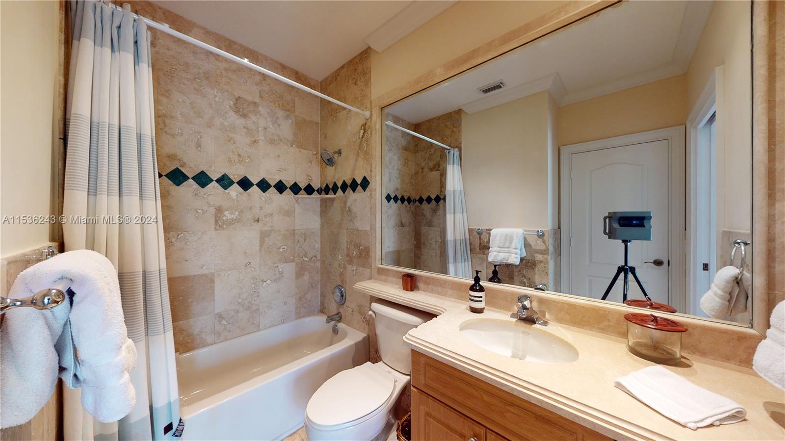 3060 Indiana Street, Unit 3060 Coconut Grove, FL 33133 - Photo 45 of 52 a bathroom with a sink and a mirror