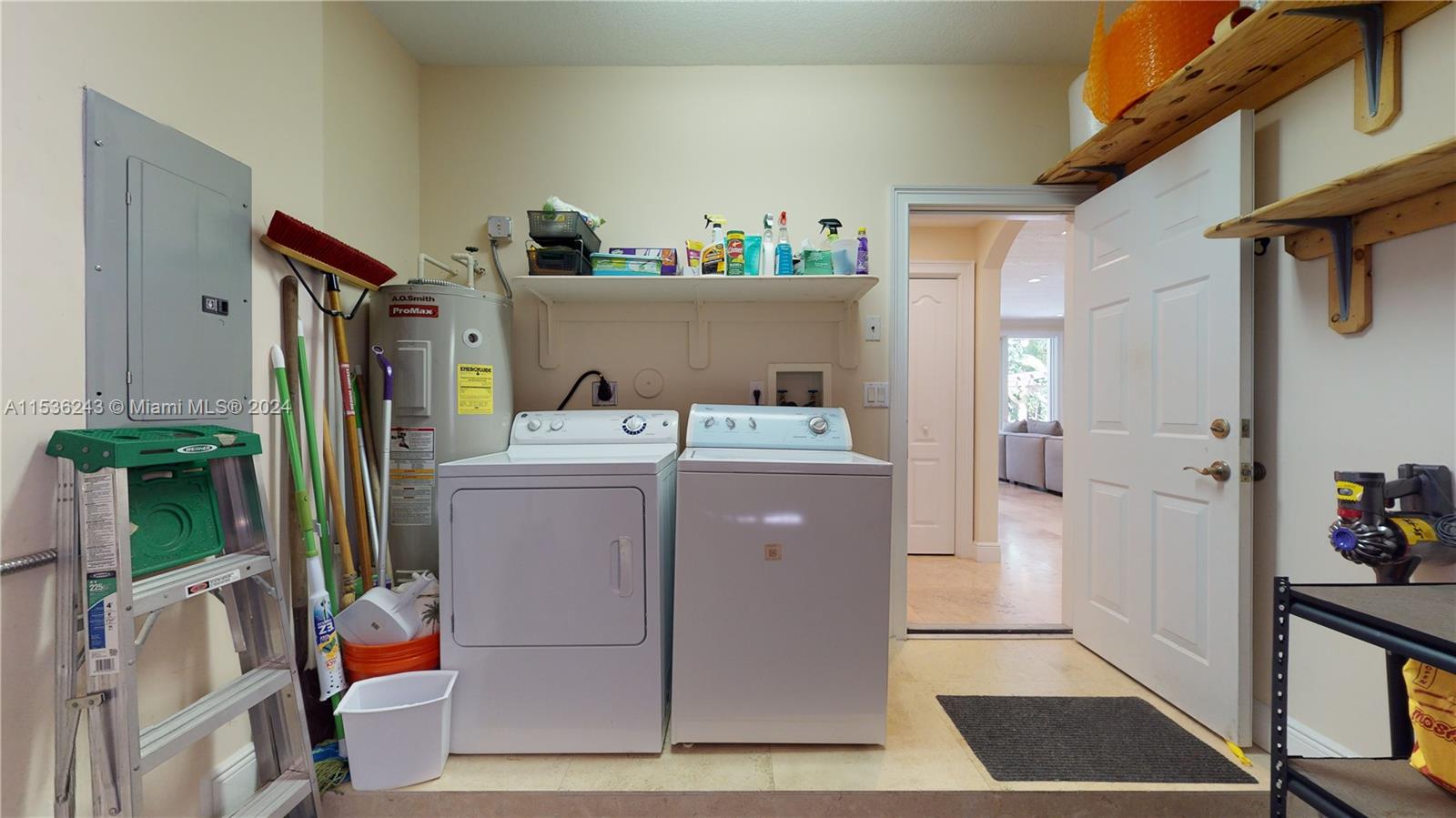 3060 Indiana Street, Unit 3060 Coconut Grove, FL 33133 - Photo 10 of 52 a utility room with dryer and washer