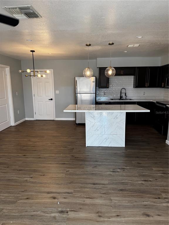 409 Fern Road Winter Haven, FL 33880 - Photo 12 of 21 a living room with furniture and a wooden floor