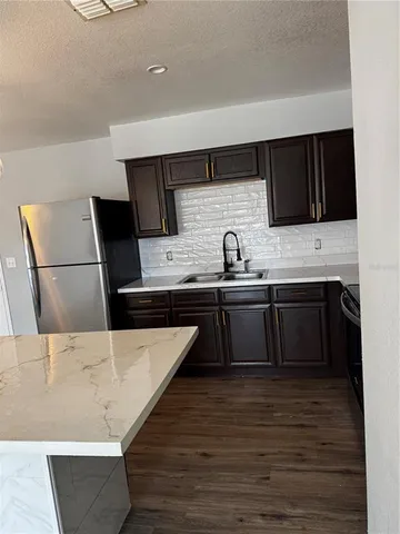 a kitchen with a sink and cabinets