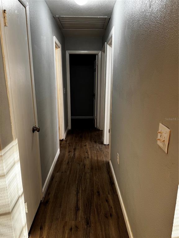 409 Fern Road Winter Haven, FL 33880 - Photo 10 of 21 a view of a hallway and wooden floor