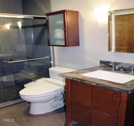 26963 Calamine Drive Calabasas, CA 91301 - Photo 16 of 31 a bathroom with a granite countertop toilet sink and mirror