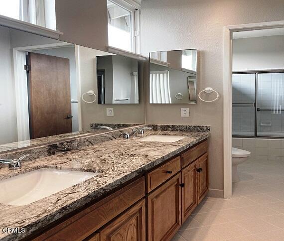 26963 Calamine Drive Calabasas, CA 91301 - Photo 21 of 31 a bathroom with a granite countertop sink and a mirror