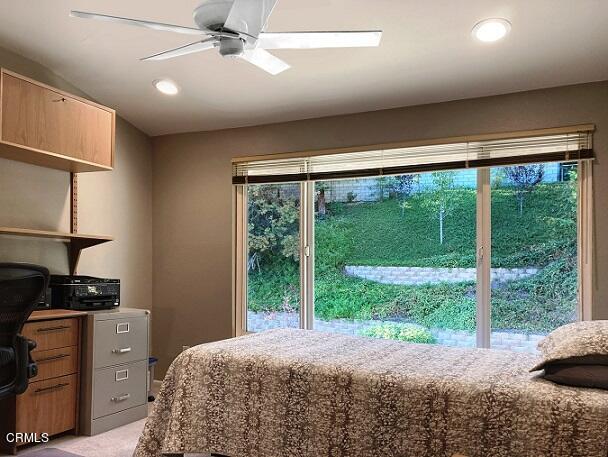 26963 Calamine Drive Calabasas, CA 91301 - Photo 24 of 31 a bedroom with a bed and a large window