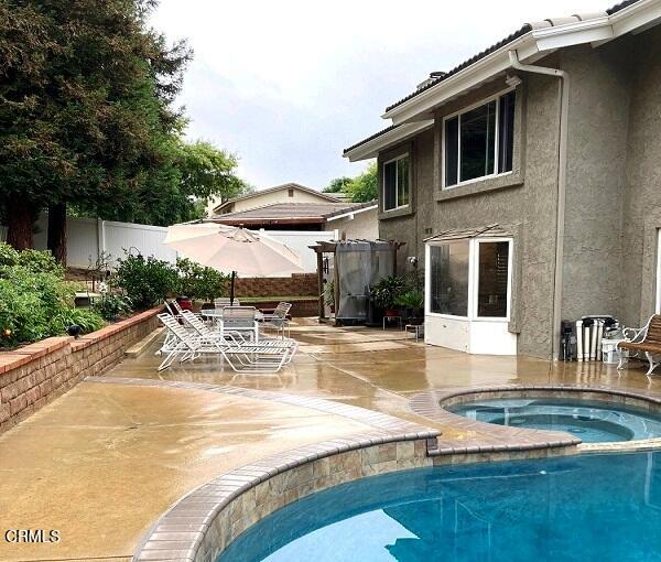 26963 Calamine Drive Calabasas, CA 91301 - Photo 26 of 31 a view of a house with pool and chairs