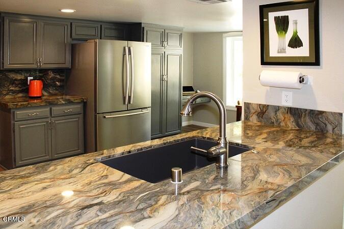 26963 Calamine Drive Calabasas, CA 91301 - Photo 10 of 31 a kitchen with granite countertop a refrigerator and a sink