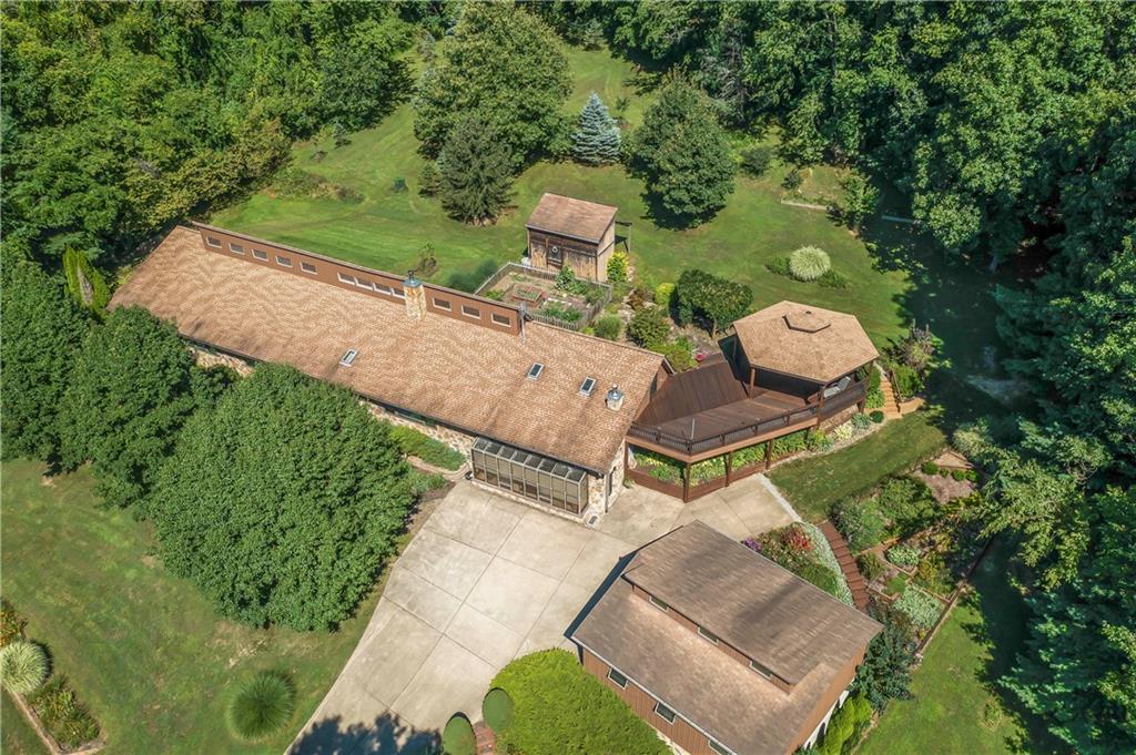 143 Lynn Road Washington, PA 15301 - Photo 1 of 25 an aerial view of a house with a yard and lake view