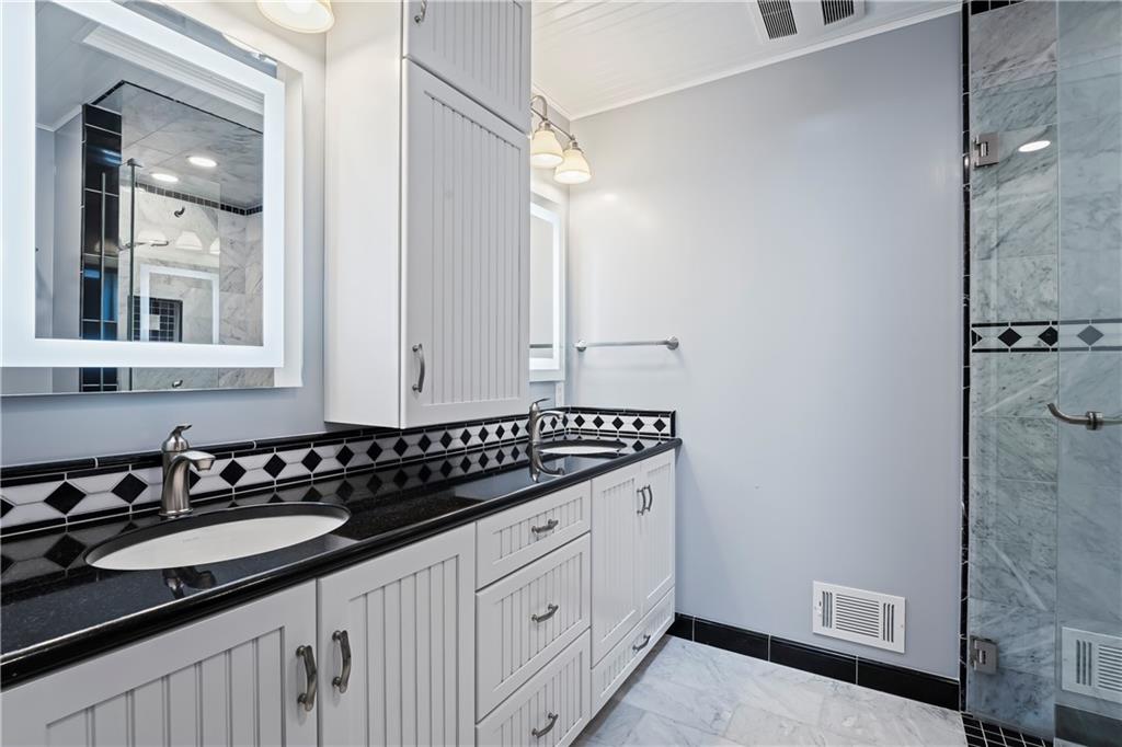 143 Lynn Road Washington, PA 15301 - Photo 15 of 25 a bathroom with a sink and a mirror