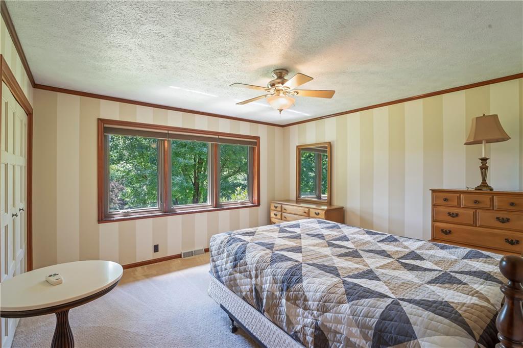 143 Lynn Road Washington, PA 15301 - Photo 17 of 25 a bedroom with a bed and a chair