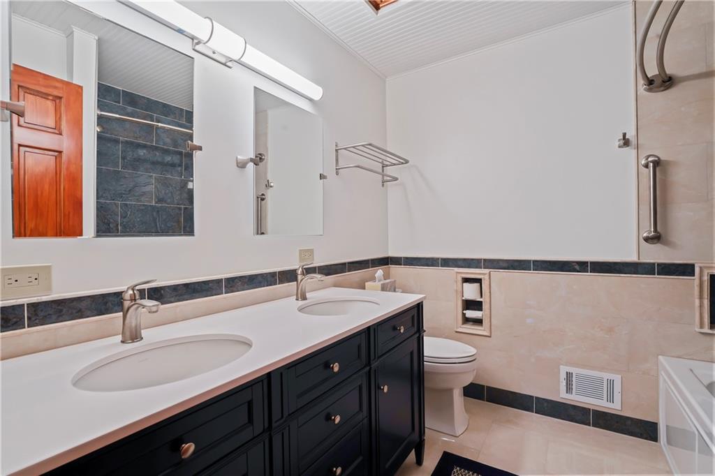 143 Lynn Road Washington, PA 15301 - Photo 19 of 25 a bathroom with a sink and a mirror