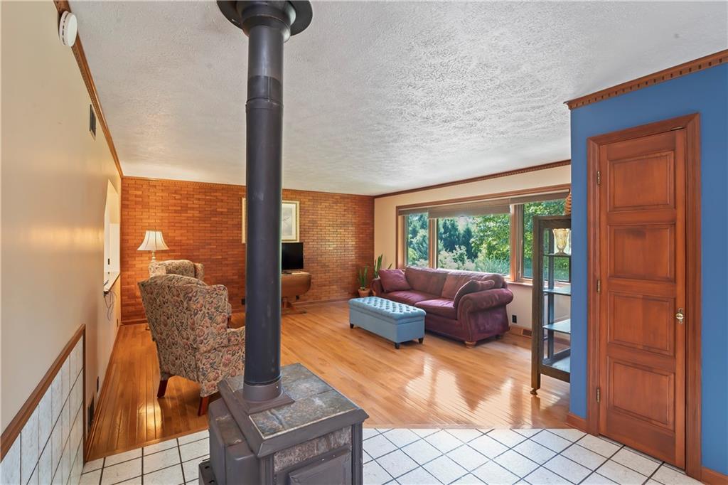 143 Lynn Road Washington, PA 15301 - Photo 7 of 25 a living room with furniture and a floor to ceiling window
