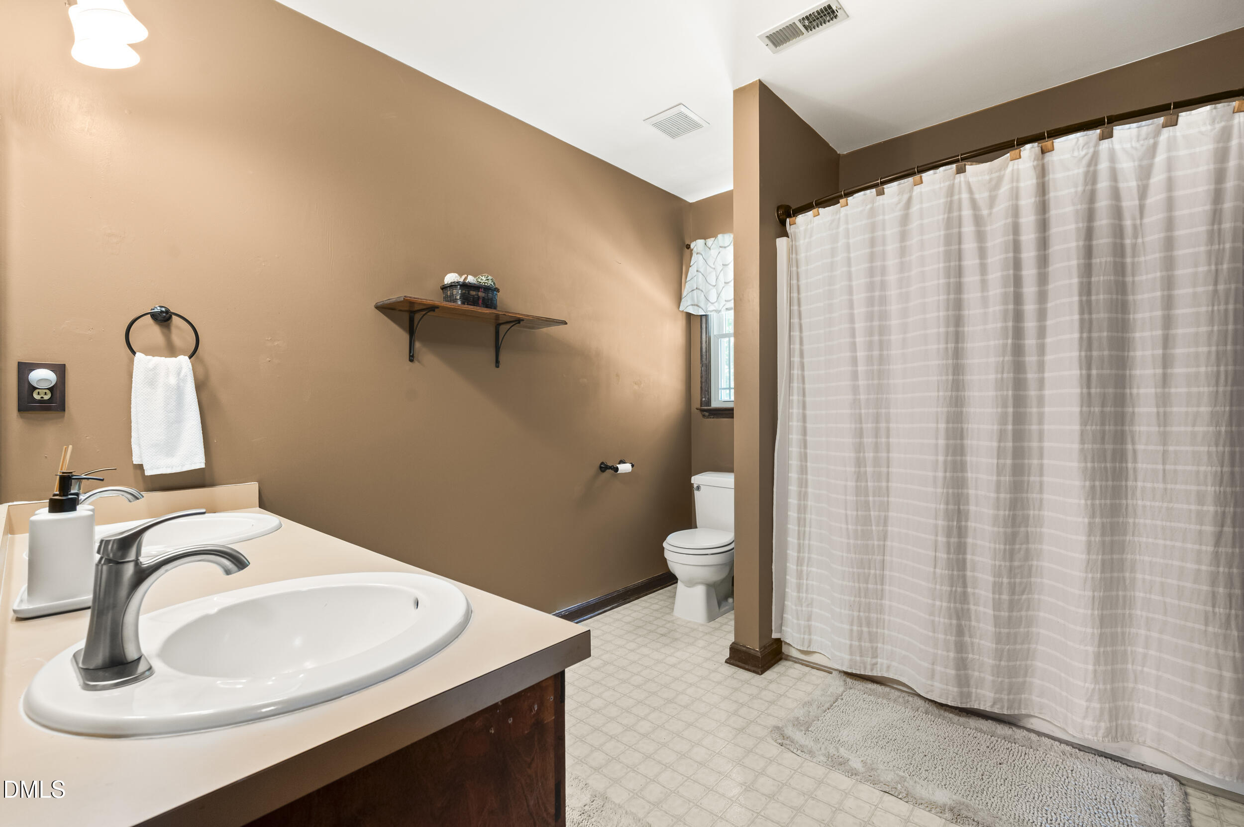 4209 Lassiter Road Wake Forest, NC 27587 - Photo 30 of 39 a bathroom with a sink and a mirror